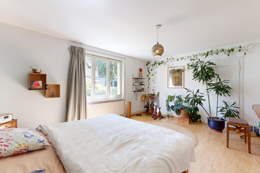 room featuring pendant lighting and light wood-type flooring