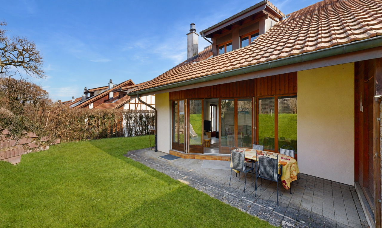 façade avec cheminée, pelouse, toit en tuiles, terrasse, et from property