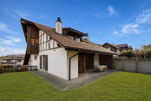 view of home with a chimney, stucco siding, a tile roof, a fenced backyard, and a patio