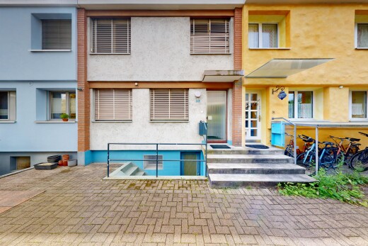 outdoor house with stucco siding and a patio