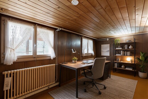 office featuring radiator heating unit, wood ceiling, and wooden walls