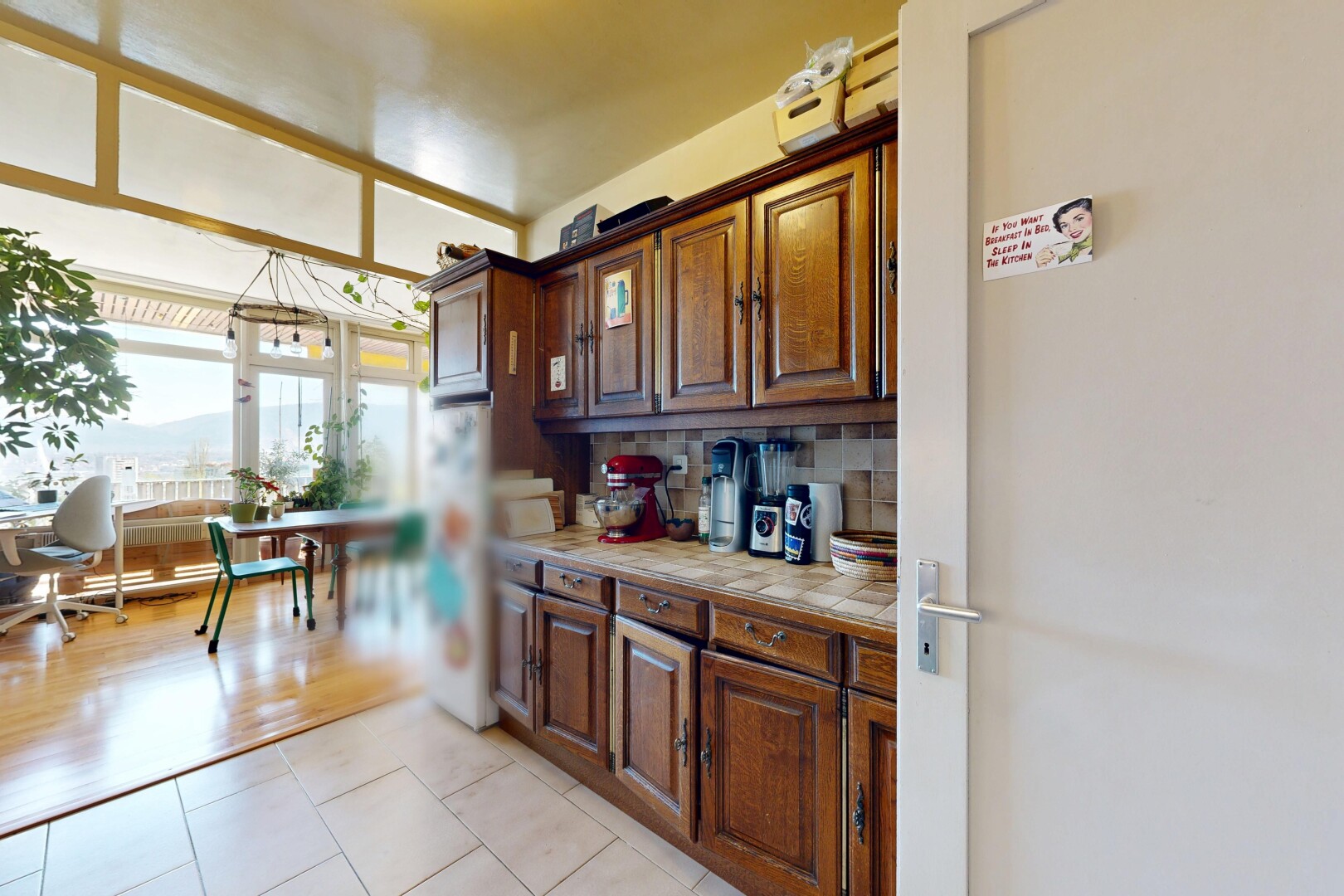 küche mit light countertops, fliesenarbeitsplatten, tile countertops, natürliches licht, und natural light