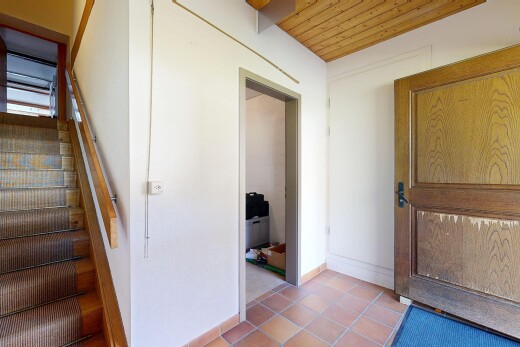 staircase with wooden ceiling and tile patterned floors