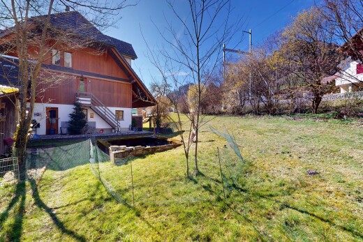 garden featuring a lawn and stairway