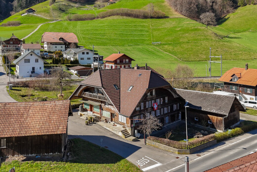 outdoor house with a view of rural / pastoral area and a chimney
