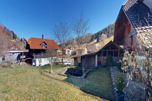 view of property featuring a yard and a residential view