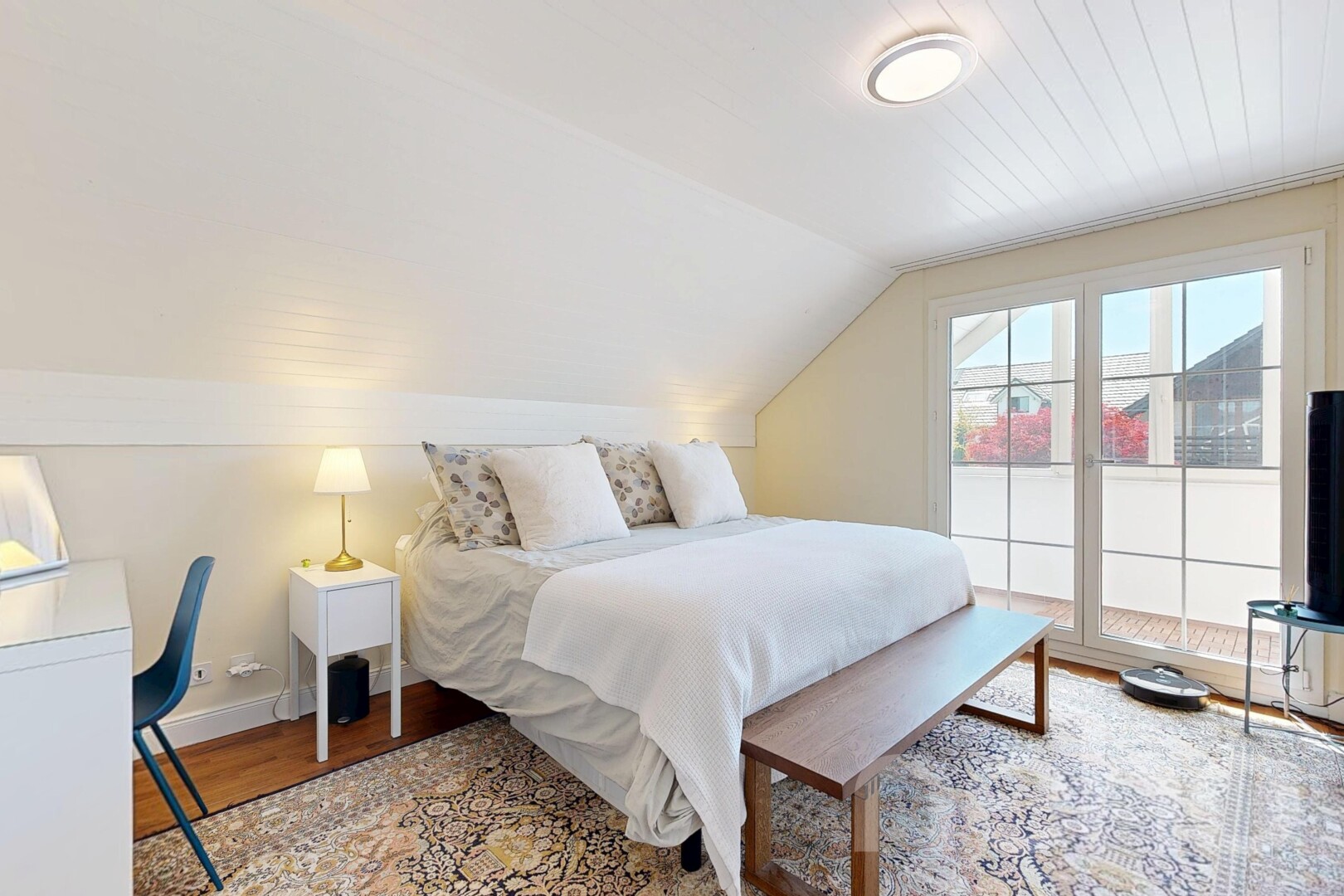 room with lofted ceiling and light wood finished floors