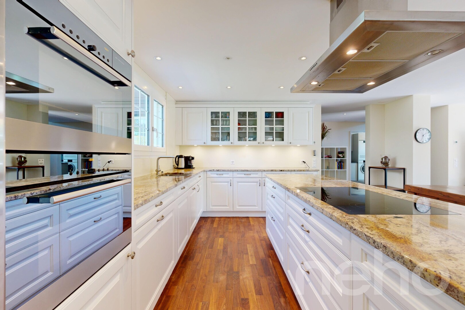 kitchen with stainless steel double oven, ventilation hood, light stone counters, white cabinets, and recessed lighting