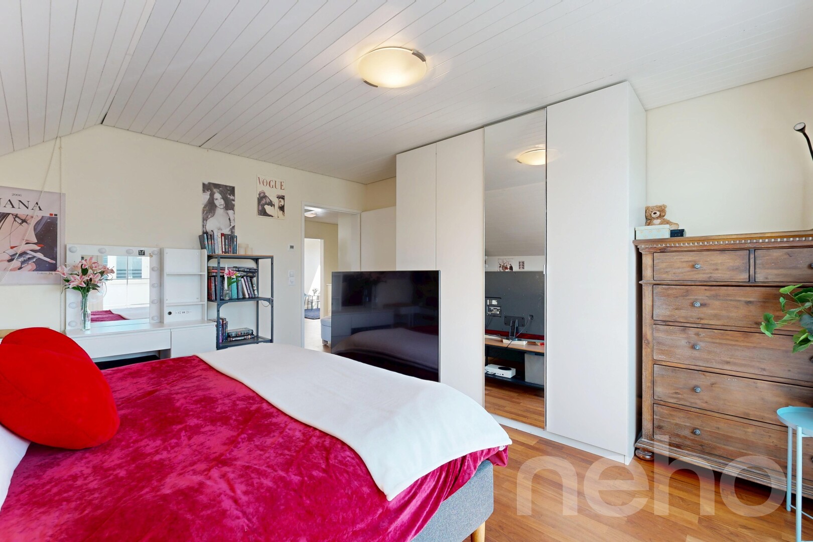 room / bedroom featuring light wood finished floors, a closet, and a vaulted wooden ceiling
