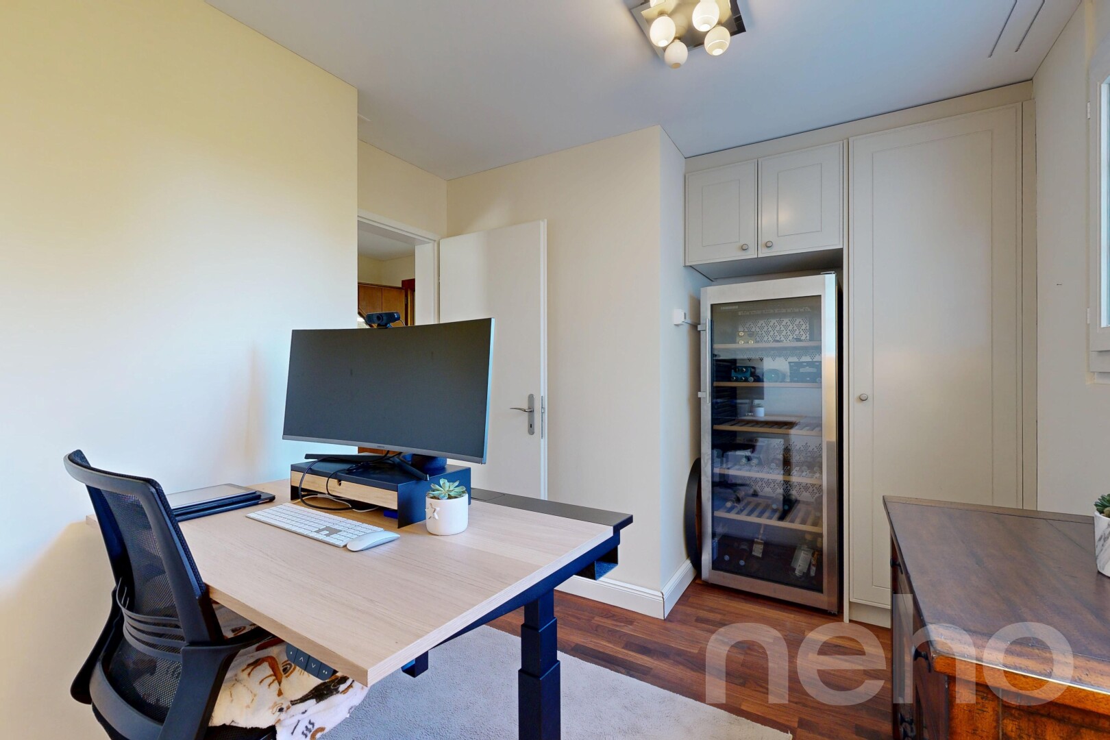 home office featuring wine cooler and dark wood-type flooring