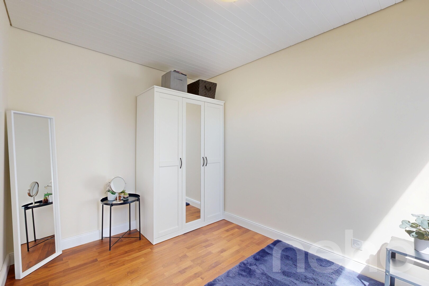 empty room with light wood-style floors and baseboards