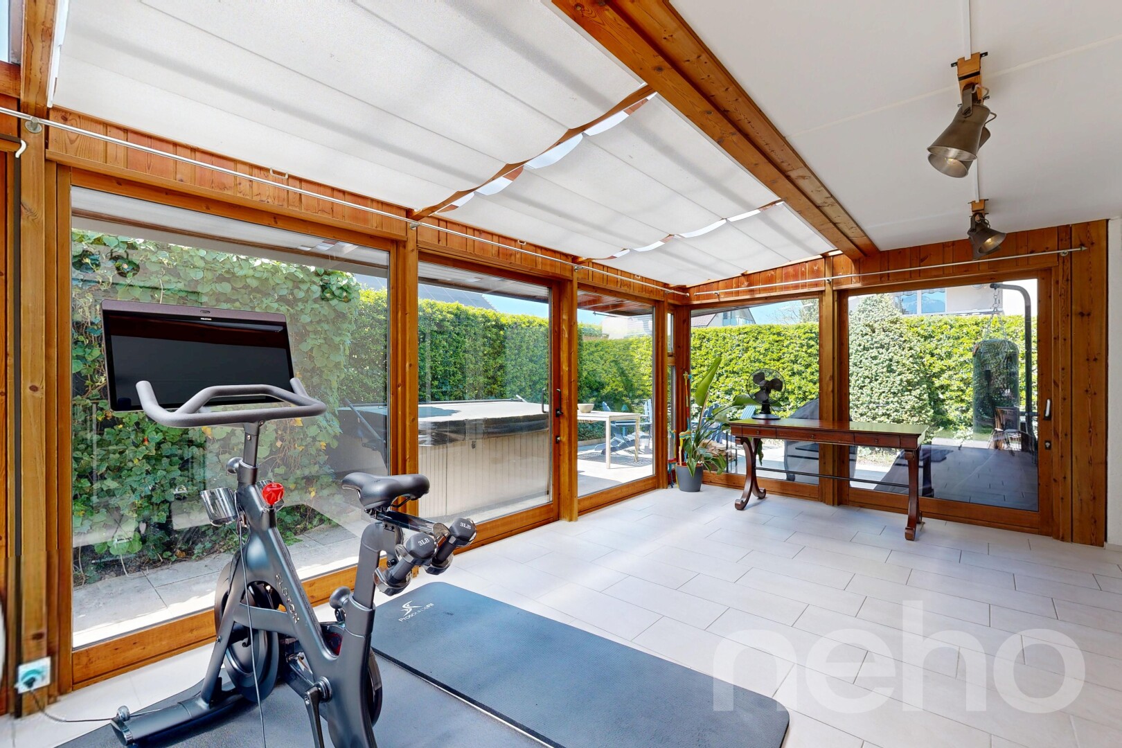 exercise room featuring beamed ceiling