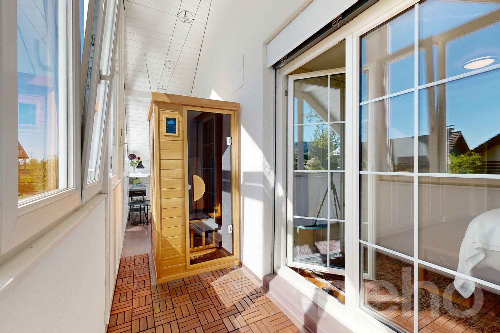 balcony featuring a sunroom