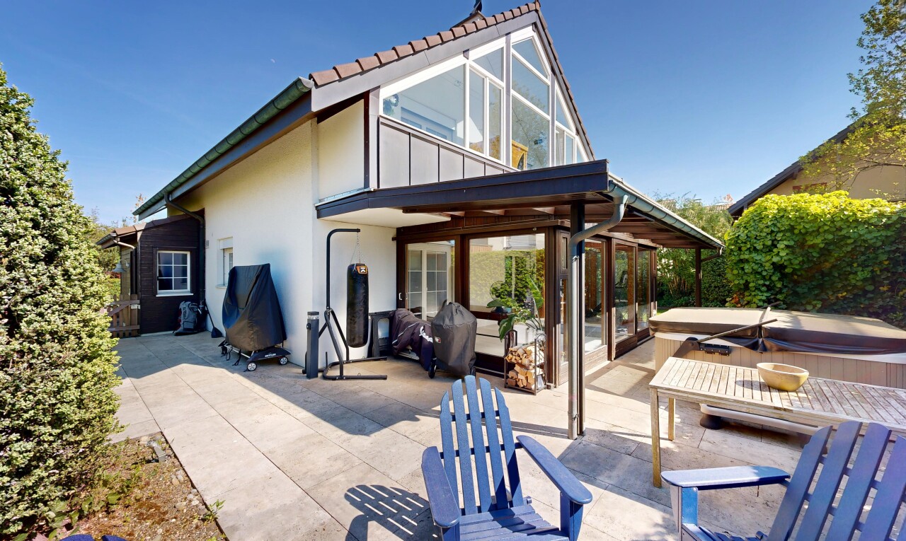 terrace featuring a patio, a hot tub, and a grill
