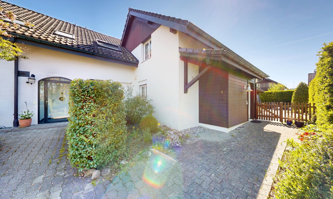 view of property with stucco siding and a patio area