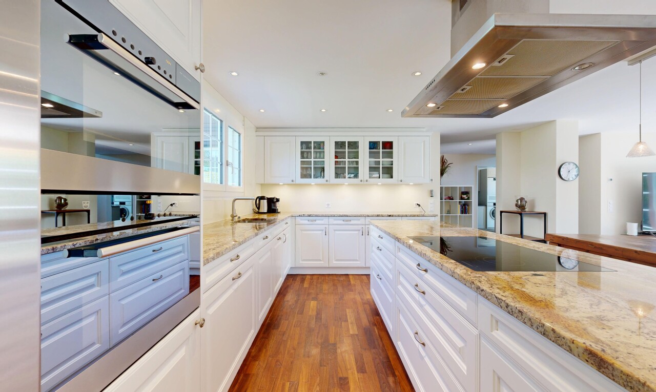 kitchen with stainless steel double oven, ventilation hood, light stone counters, white cabinets, and recessed lighting