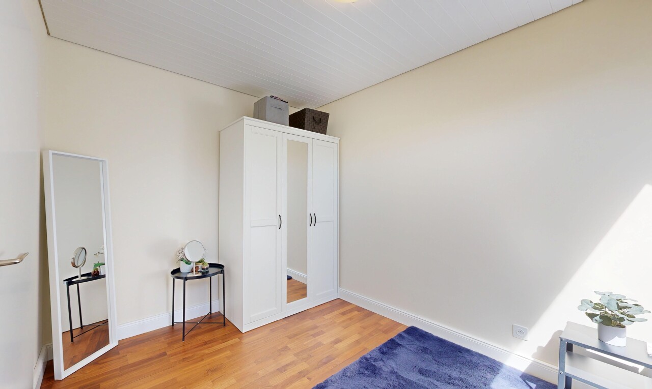 empty room with light wood-style floors and baseboards