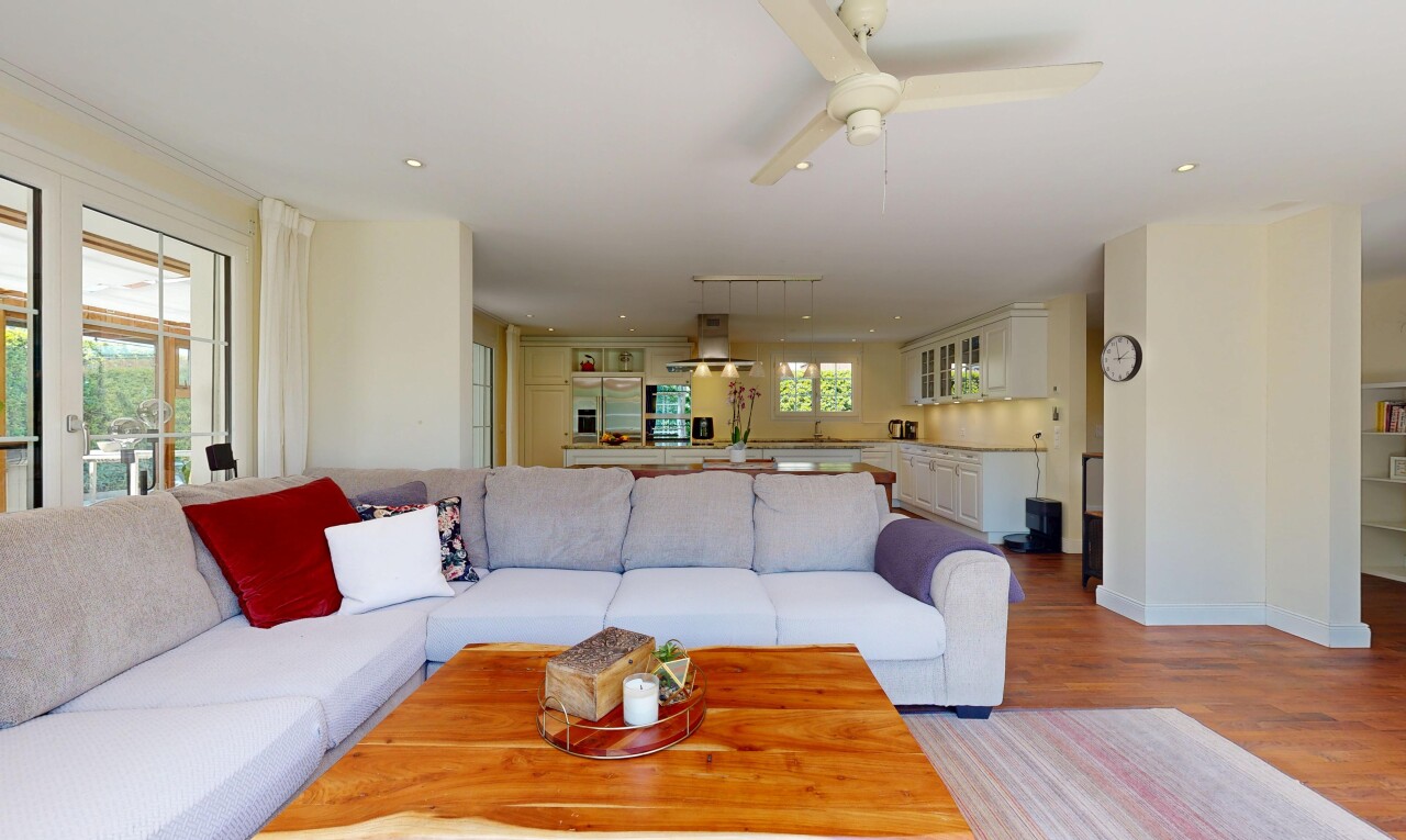 living room featuring wood finished floors, ceiling fan, and recessed lighting