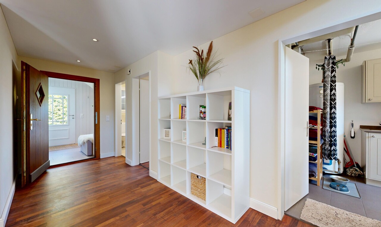 corridor featuring dark wood-type flooring and recessed lighting