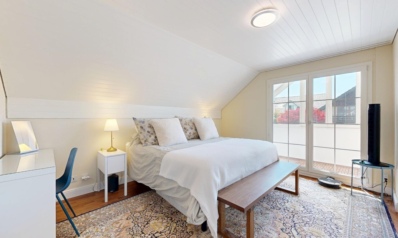 room with lofted ceiling and light wood finished floors