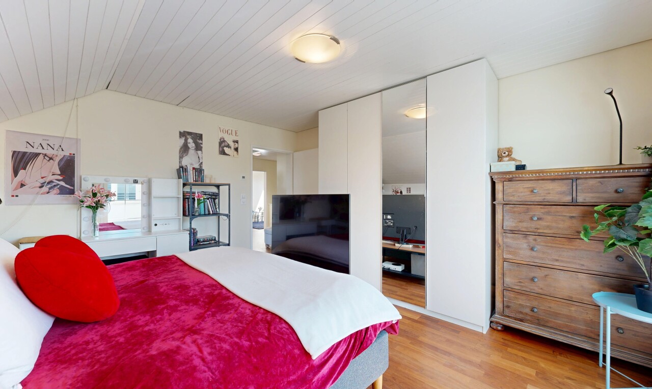 room / bedroom featuring light wood finished floors, a closet, and a vaulted wooden ceiling
