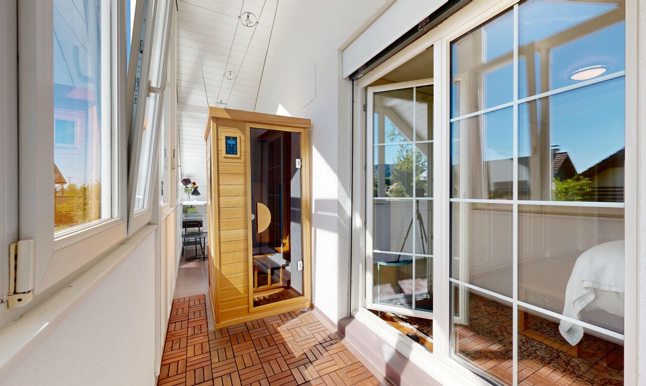 balcony featuring a sunroom