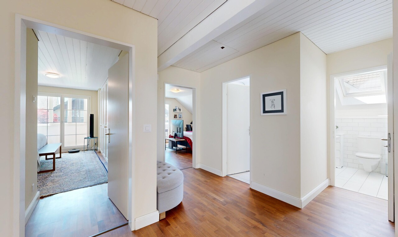 hall with wood finished floors and wooden ceiling