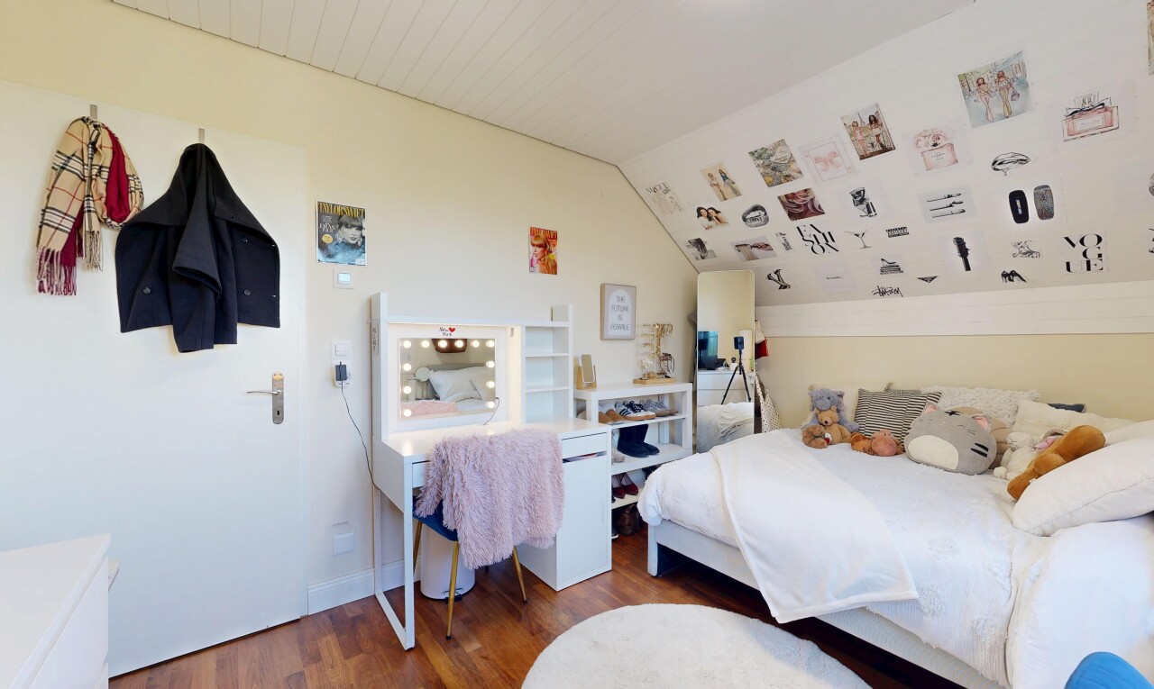 room / bedroom with wood finished floors and vaulted ceiling