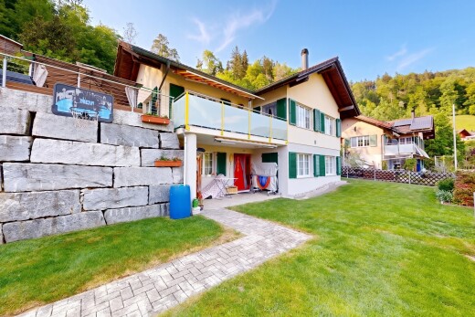 view of home featuring stucco siding and a balcony