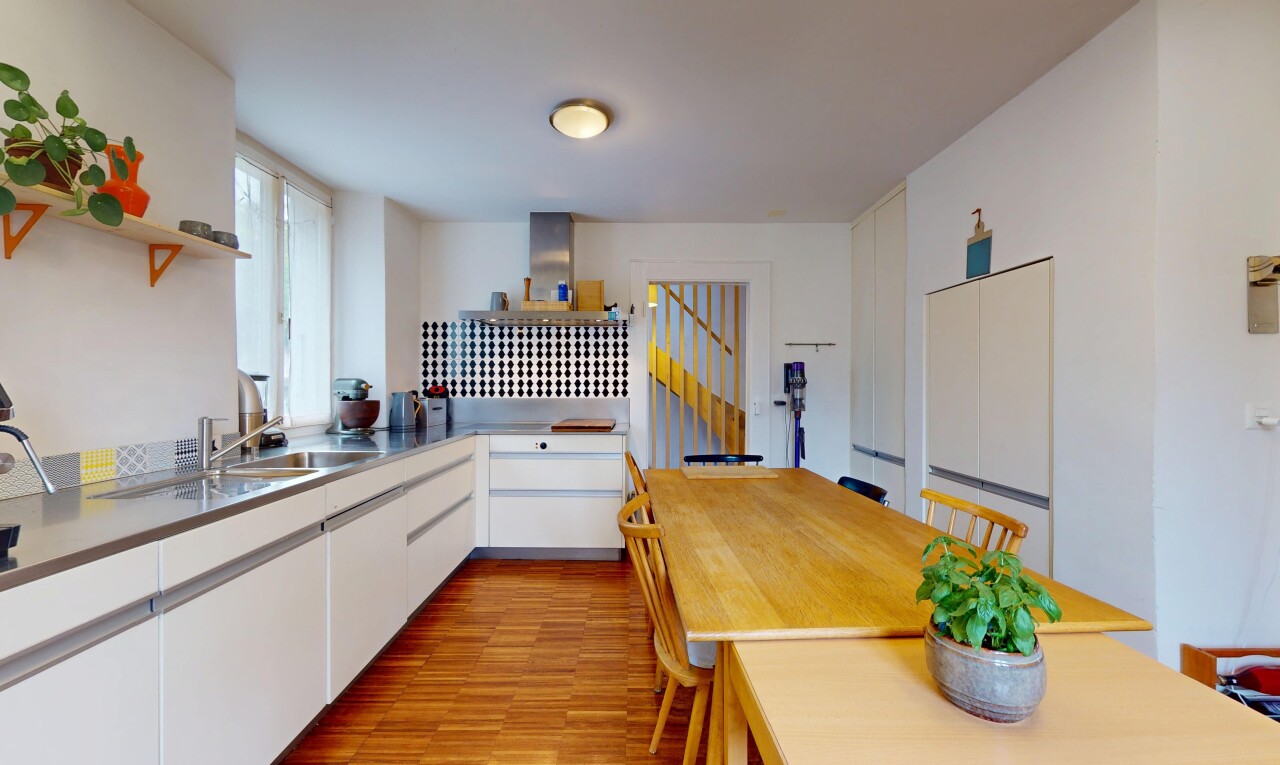 kitchen with wood finished floors, white cabinets, open shelves, and island range hood