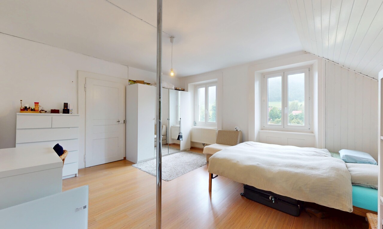 room / bedroom featuring light wood-type flooring and vaulted ceiling