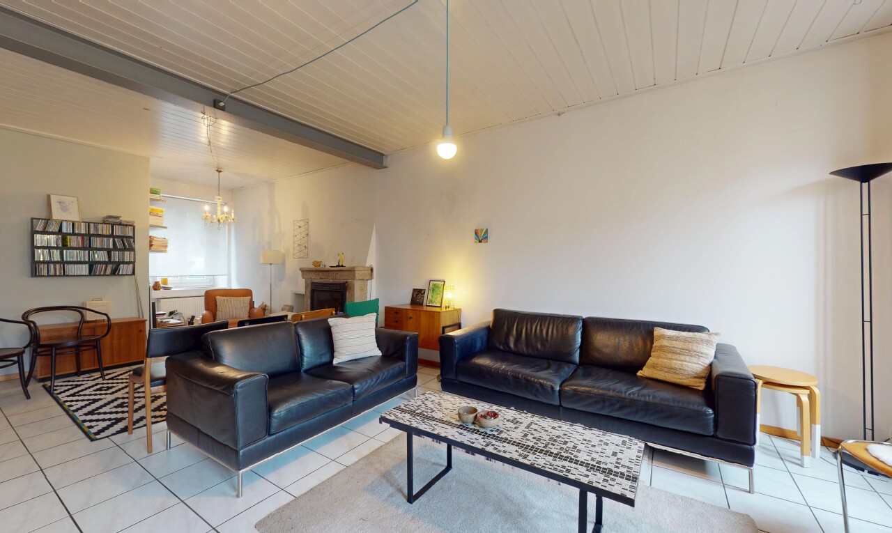 living area with tile patterned floors, a chandelier, a fireplace, and a wood ceiling with exposed beams