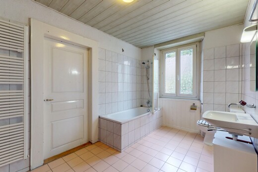 bad mit tile tub, kühler, tile floor, fliesenboden, und natural light