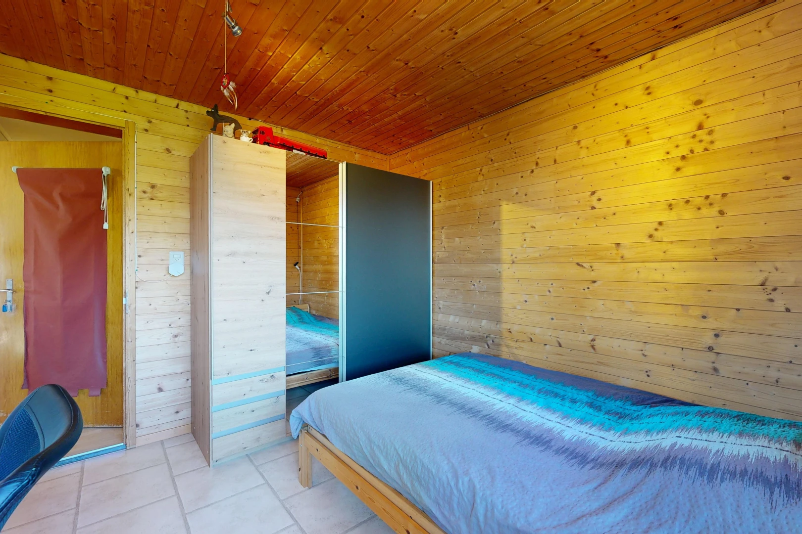 room with wooden walls and wood ceiling