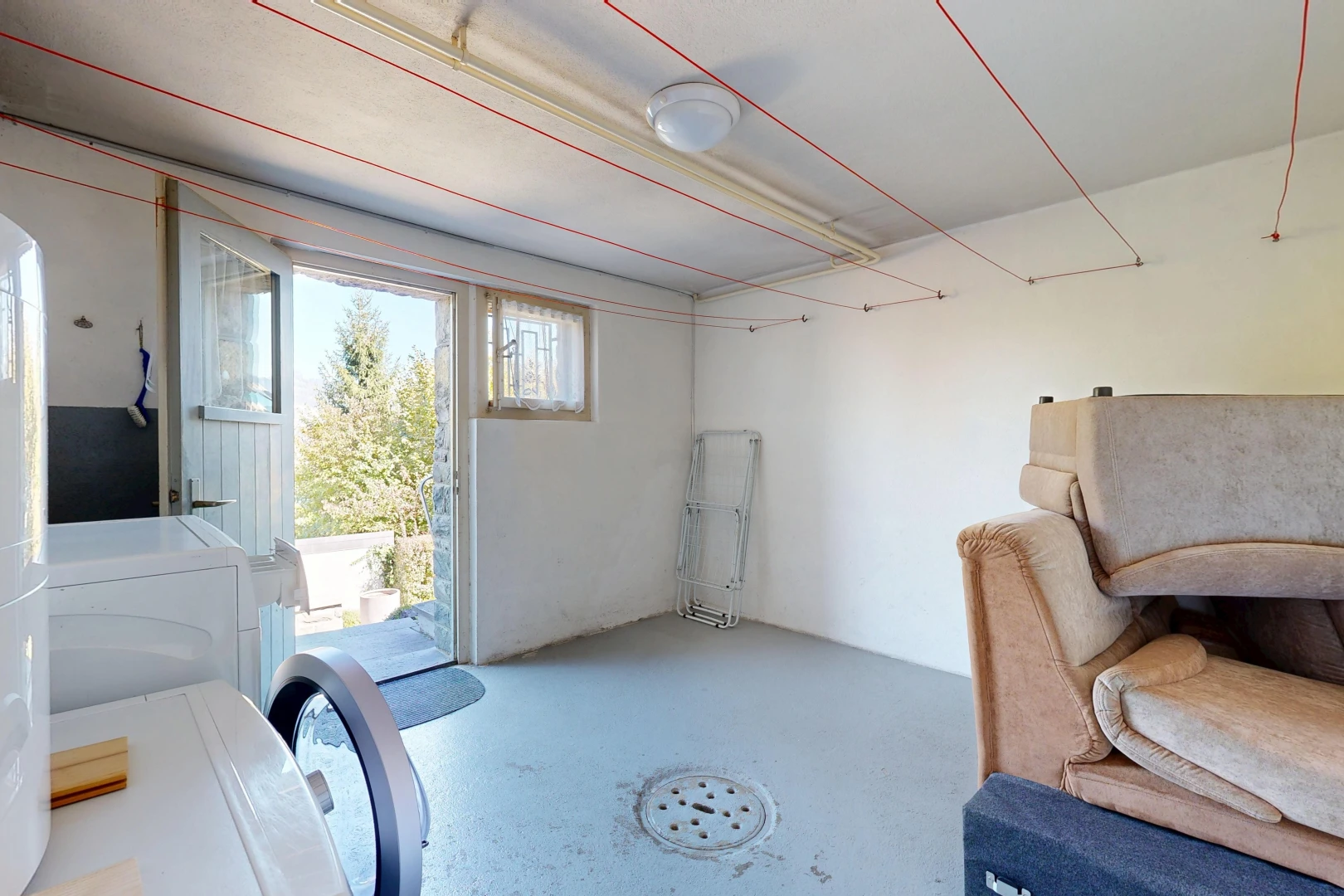 room / bedroom with access to exterior and concrete floors