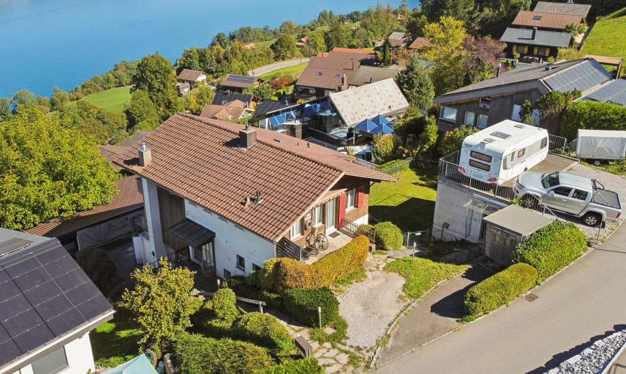view of property with a residential view and a water view
