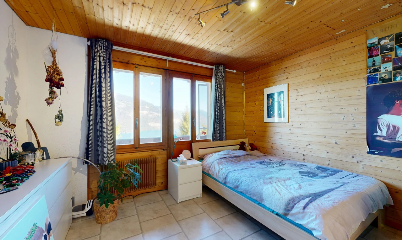 room / bedroom featuring wooden ceiling, wood walls, radiator, track lighting, and light tile patterned floors