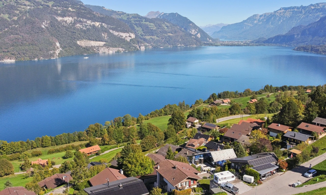 water view featuring nearby suburban area and a mountain backdrop