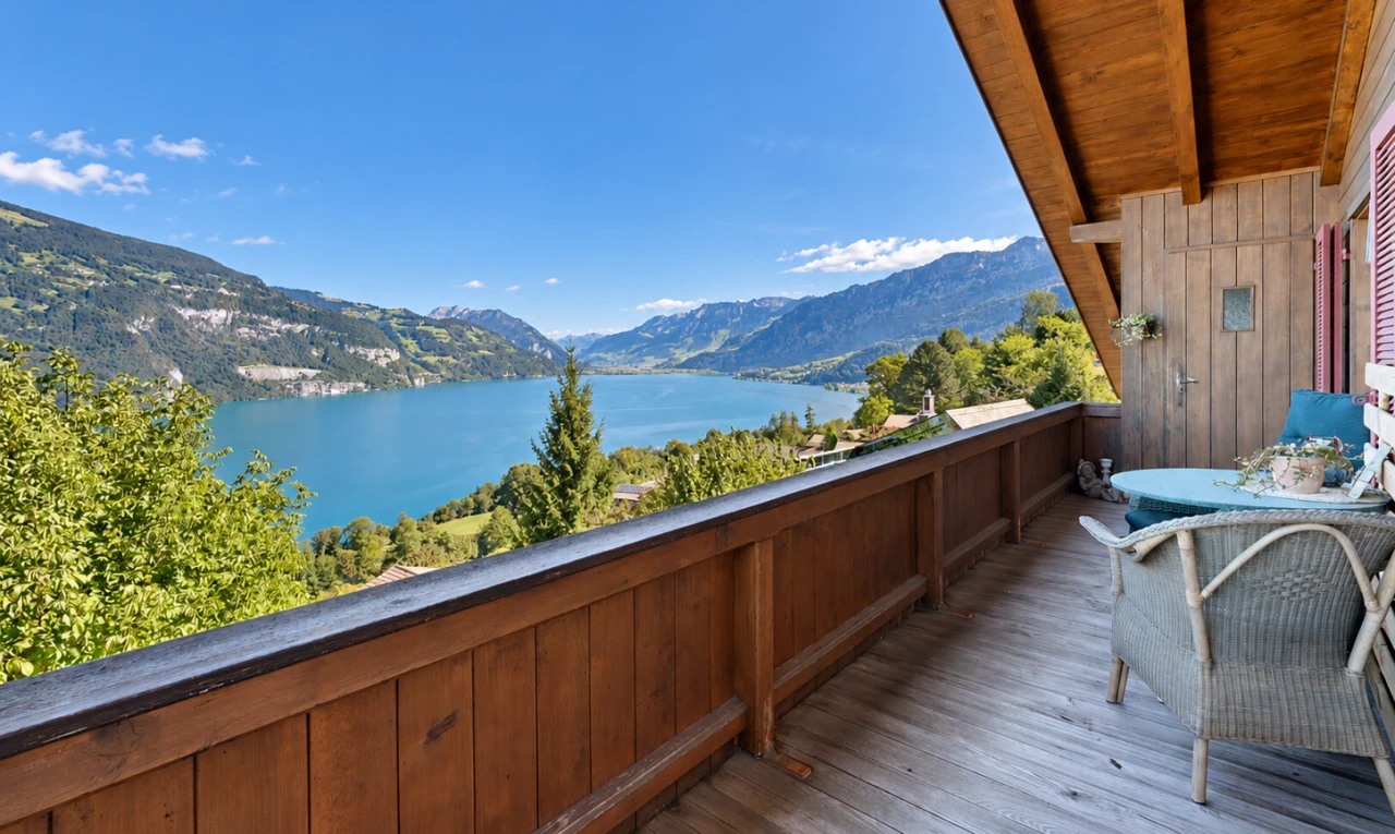 balcony featuring a water and mountain view