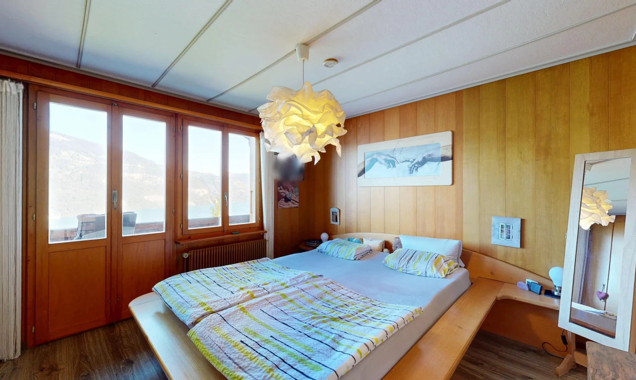 room featuring wooden walls, radiator, and dark wood-style floors