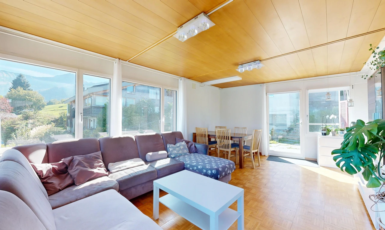 living / dining room featuring access to outside, parquet flooring, and wooden ceiling