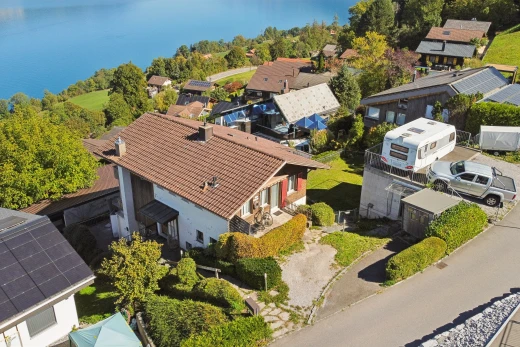 view of property with a residential view and a water view