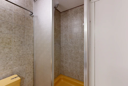 full bathroom featuring a stall shower