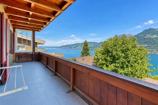 balcony with a water and mountain view