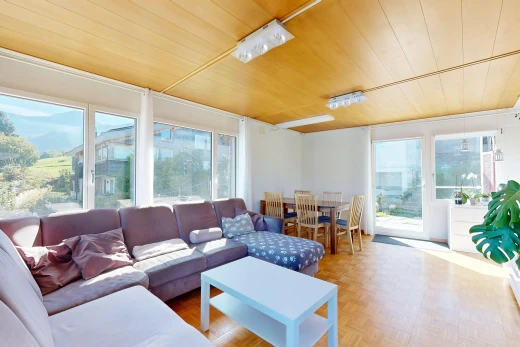 living / dining room featuring access to outside, parquet flooring, and wooden ceiling