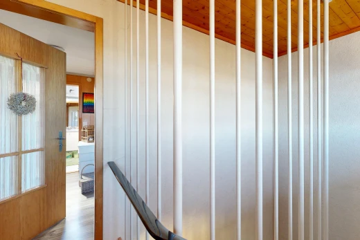stairway with wooden ceiling