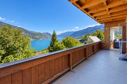 balcony with a water and mountain view