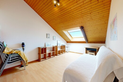 chambre avec cloison sèche, drywall, sol en finition bois, wood finish floor, et inside property