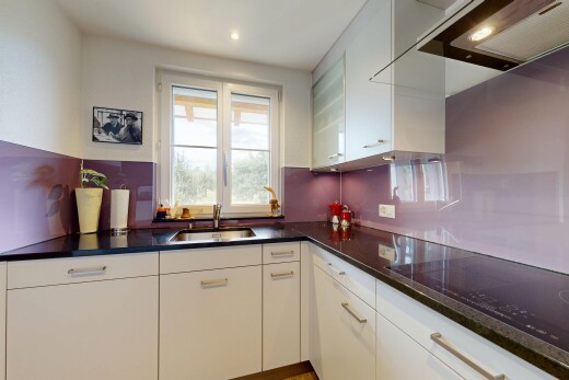 kitchen with white cabinets, black electric cooktop, extractor fan, recessed lighting, and dark stone countertops