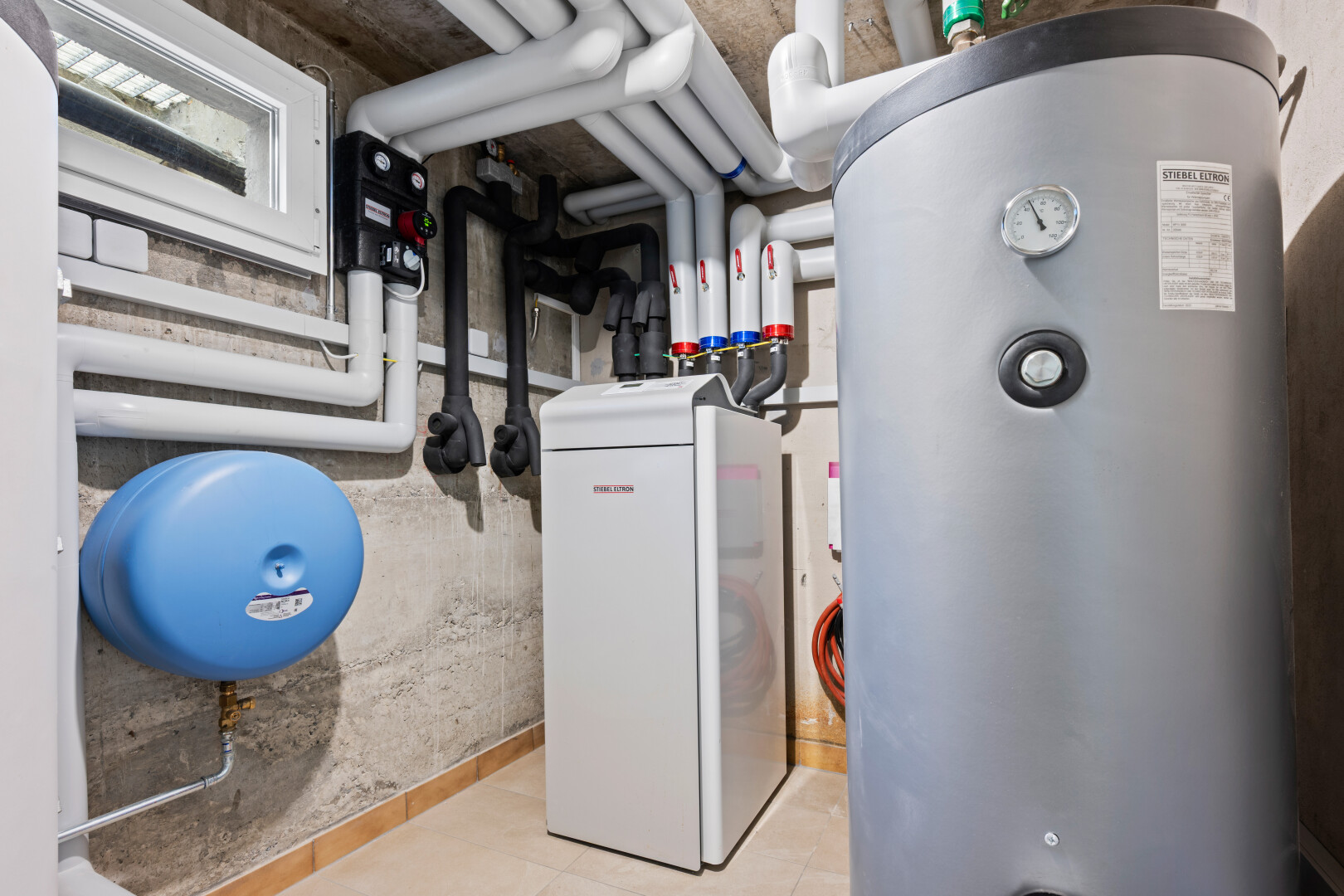 laundry room with water heater